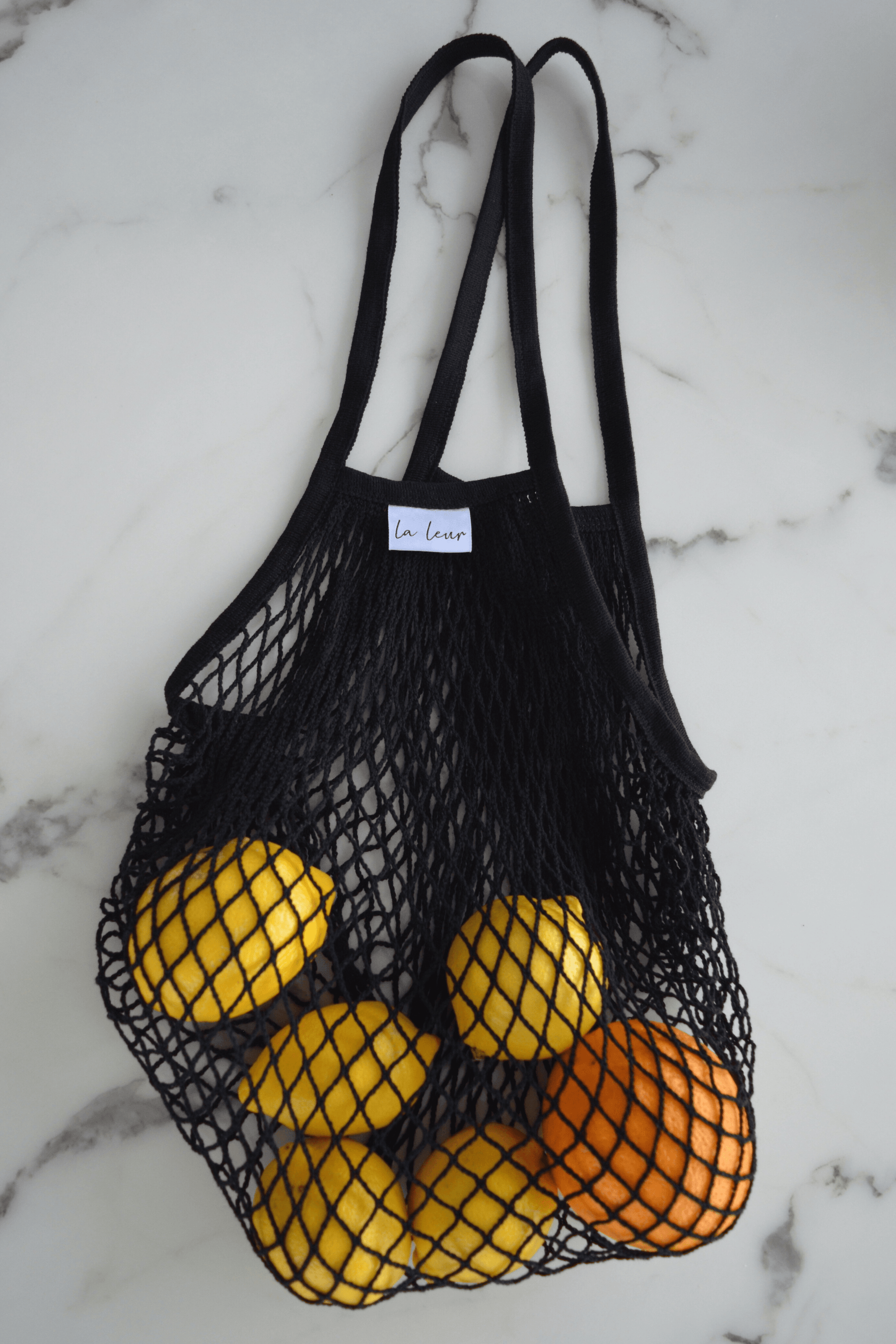 Front view of Cotton net bag with fruits