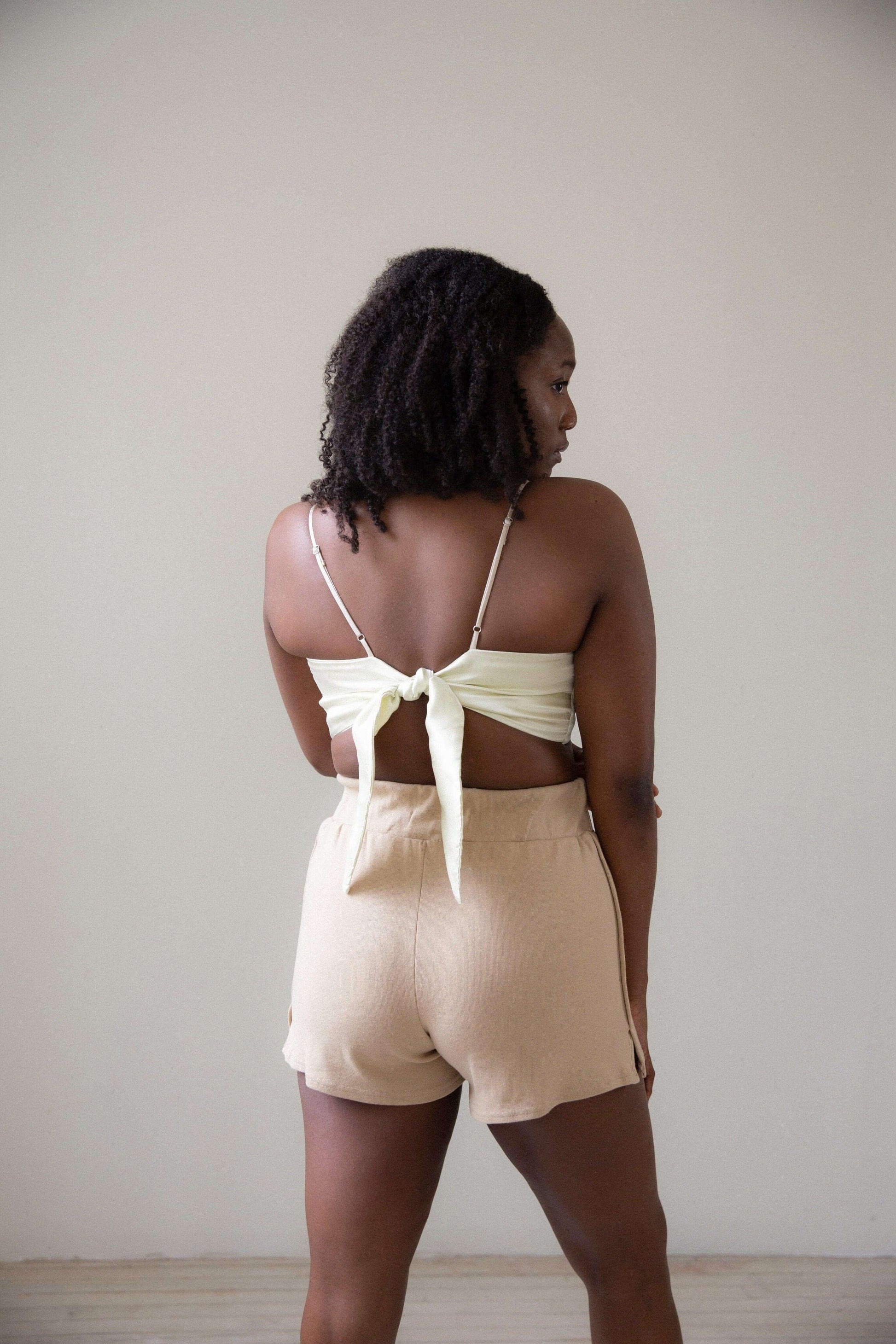 Back of Model 2 wearing the Sienna Bandeau in Yellow Pearl colour, with Bomi knit short in Coffee Cream colour
